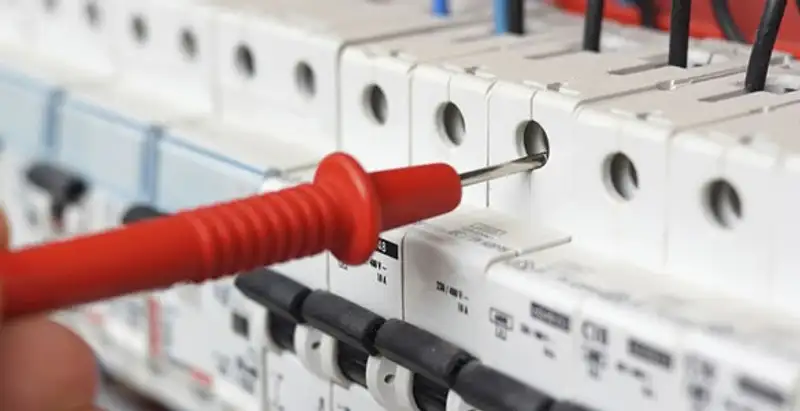 Electrical contractor testing circuit breakers during electrical repair in Garland, TX