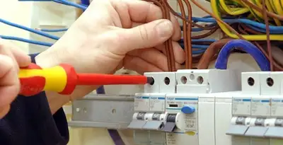 electrician services performing professional electrical panel wiring and connections in Dallas, TX