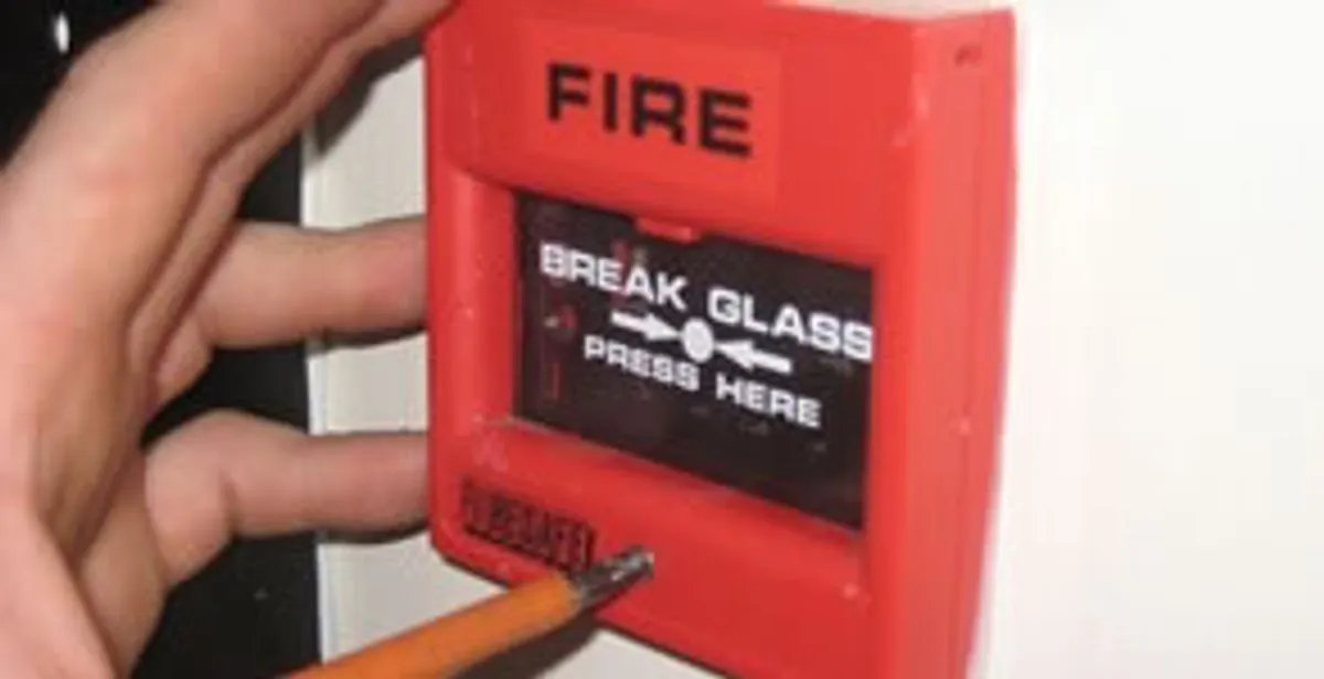 fire alarm installation service showing manual fire alarm pull station installed by licensed electricians in Dallas, TX