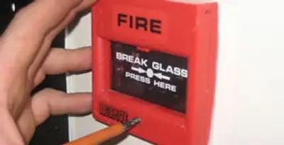 fire alarm installation service showing manual fire alarm pull station installed by licensed electricians in Dallas, TX