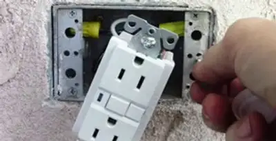 gfci circuits service showing installation of a ground fault circuit interrupter outlet by licensed electricians in Dallas, TX