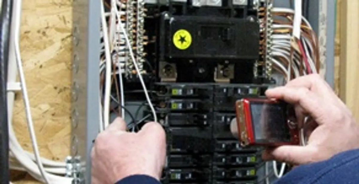 Home electrical inspection of circuit breaker panel by licensed electrician in Dallas, TX