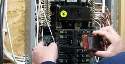 Home electrical inspection of circuit breaker panel by licensed electrician in Dallas, TX
