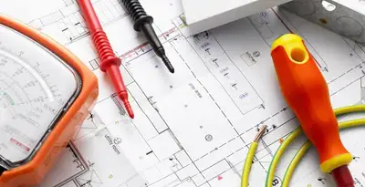 licensed electrician planning and testing electrical systems using professional tools in Dallas, TX