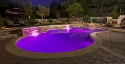 pool light installation and repair services illuminating a residential swimming pool in Dallas, TX