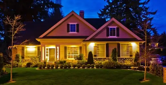 security light installation services illuminating a residential exterior at night in Dallas, TX