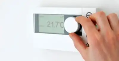 Thermostat installation service with professional adjusting temperature control in Dallas, TX